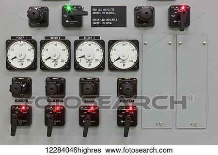 Stock Photograph - Indicator lights and dials on a control panel in an electrical power plant, Sand Point, Southwestern Alaska, USA, Summer. Fotosearch