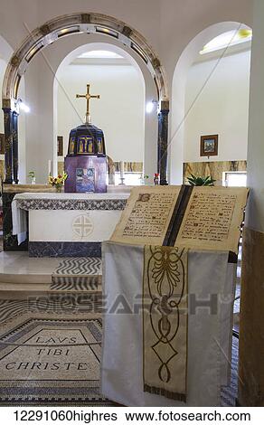 Interior of a church with altar and podium with sheet music on display; Galilee, Israel View Large Photo Image Stock Photograph - Interior of a church with altar and podium with sheet music on display; Galilee, Israel. Fotosearch