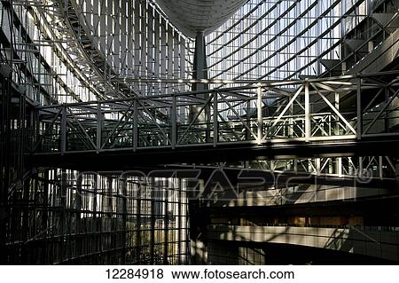 Interior of a modern building with glass walls and walkway; Tokyo, Japan View Large Photo Image Stock Photo - Interior of a modern building with glass walls and walkway; Tokyo, Japan. Fotosearch