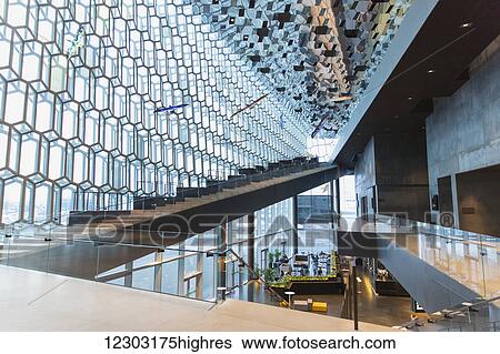 Interior of the Harpa Public Concert Hall, designed by the Danish firm Henning Larsen Architects and the Icelandic firm Batteriao Architects, the glass facade designed by Icelandic glass artist Olafur Eliasson; Reykjavik, Iceland View Large Photo Image Stock Photograph - Interior of the Harpa Public Concert Hall, designed by the Danish firm Henning Larsen Architects and the Icelandic firm Batteriao Architects, the glass facade designed by Icelandic glass artist Olafur Eliasson; Reykjavik, Iceland. Fotosearch