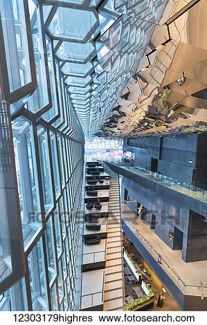 Stock Photograph - Interior of the Harpa Public Concert Hall, designed by the Danish firm Henning Larsen Architects and the Icelandic firm Batteriao Architects, the glass facade designed by Icelandic glass artist Olafur Eliasson; Reykjavik, Iceland. Fotosearch
