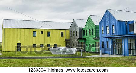 Stock Photograph - John O'Groats house with buildings painted with a sign for John O'Groats; John O'Groats, Scotland. Fotosearch