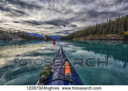 Stock Photograph - Kayaking on Atlin Lake; Atlin, British Columbia, Canada. Fotosearch