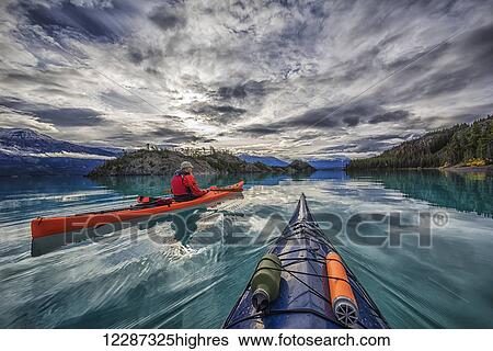 Stock Photograph - Kayaking on Atlin Lake; Atlin, British Columbia, Canada. Fotosearch