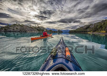 Kayaking on Atlin Lake; Atlin, British Columbia, Canada View Large Photo Image Stock Photograph - Kayaking on Atlin Lake; Atlin, British Columbia, Canada. Fotosearch