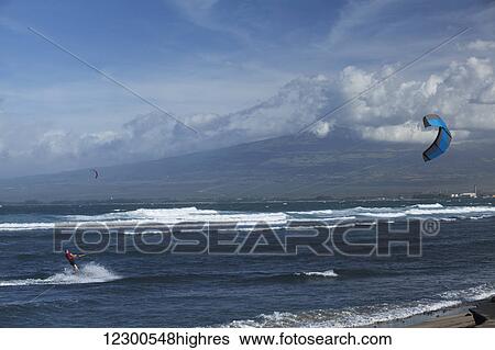 Kite surfers at Waiehu Beach, near Wailuku; Maui, Hawaii, United States of America View Large Photo Image Stock Photograph - Kite surfers at Waiehu Beach, near Wailuku; Maui, Hawaii, United States of America. Fotosearch