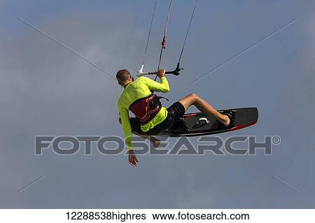 Stock Photograph - Kitesurfer catching air off Hadicurari Beach; Aruba. Fotosearch