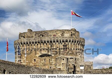 Large stone fort with colourful flags on top with blue sky and clouds; Dinan, Brittany, France View Large Photo Image Stock Photo - Large stone fort with colourful flags on top with blue sky and clouds; Dinan, Brittany, France. Fotosearch