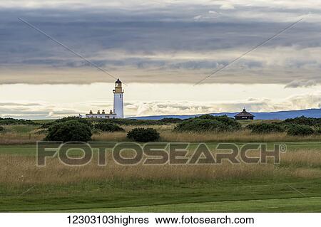 Stock Photograph - Lighthouse along the coast at dusk; Girvan, Scotland. Fotosearch