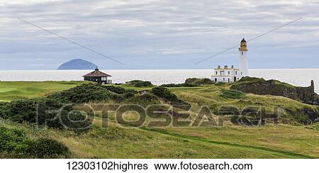 Stock Photograph - Lighthouse along the coast; Maidens, Scotland. Fotosearch