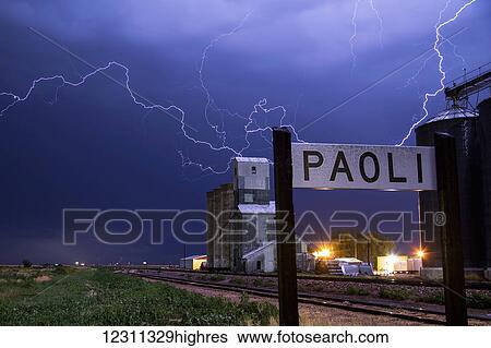 Lightning strikes behind grain elevators; Paoli, Colorado, United States of America View Large Photo Image Stock Photograph - Lightning strikes behind grain elevators; Paoli, Colorado, United States of America. Fotosearch