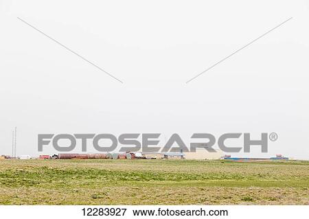 Liquid storage tanks and warehouses on St. Paul Island, Southwestern Alaska, USA, Summer View Large Photo Image Stock Photo - Liquid storage tanks and warehouses on St. Paul Island, Southwestern Alaska, USA, Summer. Fotosearch
