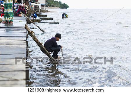 Local life in the famous Crab Market of Kep; Kep, Cambodia View Large Photo Image Stock Photograph - Local life in the famous Crab Market of Kep; Kep, Cambodia. Fotosearch