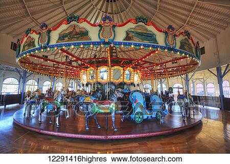 Stock Photograph - Loof Hippodrome, carousel with 45 hand carved horses, built in 1916, Santa Monica Pier; Santa Monica, California, United States of America. Fotosearch