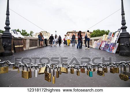 Stock Photograph - Love locks on a bridge near Trastevere; Rome, Italy. Fotosearch