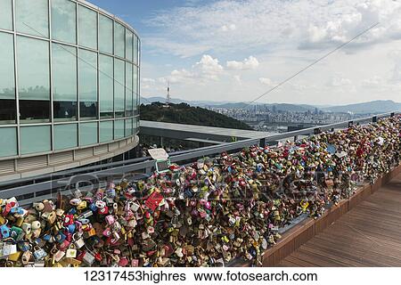Stock Photograph - Lover's locks along a railing; Seoul, South Korea. Fotosearch