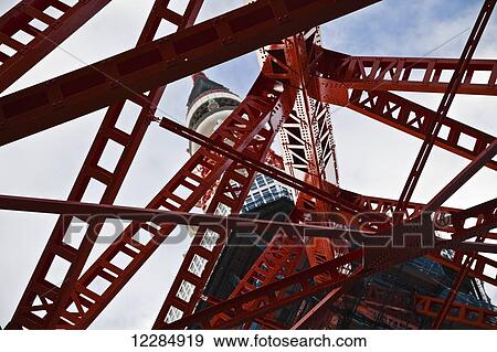 Low angle view of a red metal structure and tower; Tokyo, Japan View Large Photo Image Stock Photo - Low angle view of a red metal structure and tower; Tokyo, Japan. Fotosearch