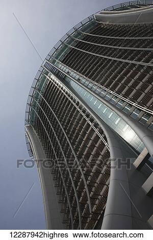 Stock Photograph - Low angle view of The Lily's sunlit facade; Hong Kong, China. Fotosearch