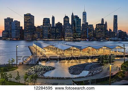 Lower Manhattan skyline at twilight, Brooklyn Bridge Park; Brooklyn, New York, United States of America View Large Photo Image Stock Photography - Lower Manhattan skyline at twilight, Brooklyn Bridge Park; Brooklyn, New York, United States of America. Fotosearch