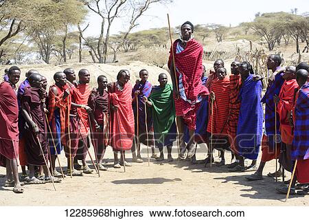 Maasai warriors wearing brightly coloured clothing perform traditional dance, Ngorongoro Crater Conservation Area; Tanzania View Large Photo Image Stock Photograph - Maasai warriors wearing brightly coloured clothing perform traditional dance, Ngorongoro Crater Conservation Area; Tanzania. Fotosearch