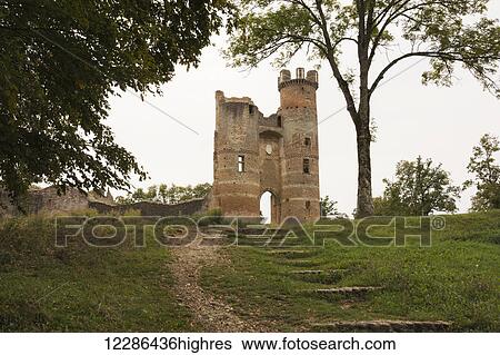 Stock Photograph - Main towers of the ruins of a XIII century castle in the French countryside; Bressieux, Isere, France. Fotosearch