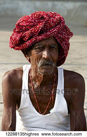 Stock Photograph - Man in red turban; Dharpatha Mal, Madhya Pradesh, India. Fotosearch