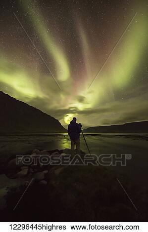 Man photographing the northern lights; Iceland View Large Photo Image Stock Photograph - Man photographing the northern lights; Iceland. Fotosearch