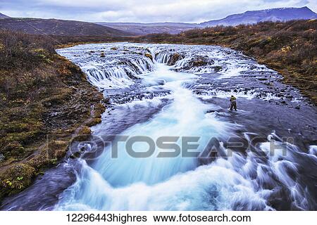 Man photographing the waterfall Bruarfoss; Iceland View Large Photo Image Stock Photograph - Man photographing the waterfall Bruarfoss; Iceland. Fotosearch