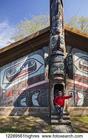 Man sits on steps of a Tlingit clan house with smart phone, Totem Bight Historic State Park, Ketchikan, Southeast Alaska, USA, Spring View Large Photo Image Stock Photograph - Man sits on steps of a Tlingit clan house with smart phone, Totem Bight Historic State Park, Ketchikan, Southeast Alaska, USA, Spring. Fotosearch