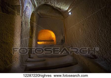 Stock Photograph - Manmade cave dwellings; Goreme, Cappadocia, Turkey. Fotosearch