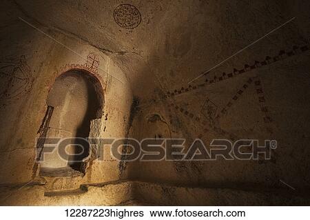 Stock Photograph - Manmade cave dwellings; Goreme, Cappadocia, Turkey. Fotosearch