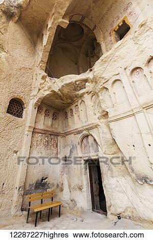 Stock Photograph - Manmade cave dwellings; Goreme, Cappadocia, Turkey. Fotosearch