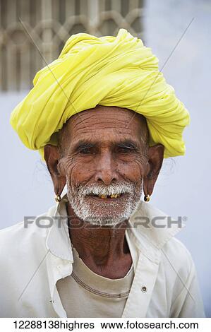 Mature man in a yellow turban; Dharpatha Mal, Madhya Pradesh, India View Large Photo Image Stock Photograph - Mature man in a yellow turban; Dharpatha Mal, Madhya Pradesh, India. Fotosearch