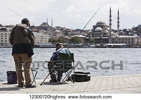 Men fishing by the waterfront across from Sultanahmet, old city; Istanbul, Turkey View Large Photo Image Stock Photograph - Men fishing by the waterfront across from Sultanahmet, old city; Istanbul, Turkey. Fotosearch