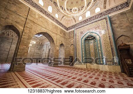 Stock Photograph - Mihrab and minbar in the Prayer Hall of the Juma Mosque of Shamakhi or Friday Mosque of Shamakhi; Shamakhi, Azerbaijan. Fotosearch