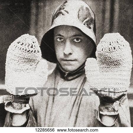 Stock Photograph - Mittens made of string, used during World War One to protect the hands of men engaged on mine sweepers. From The Pageant of the Century, published 1934. Fotosearch