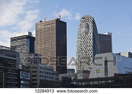 Stock Image - Modern buildings against a blue sky; Tokyo, Japan. Fotosearch