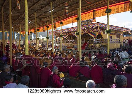 Stock Photograph - Monks and worshipers; Paro, Bhutan. Fotosearch