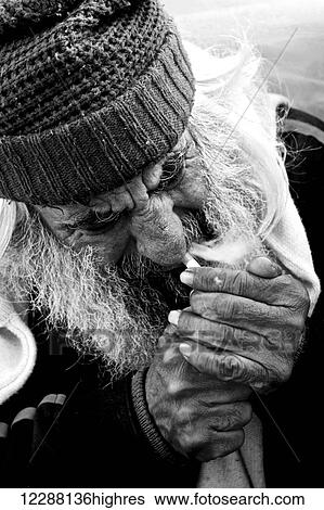 Mono bearded tramp in beanie lighting cigarette; Athens, Attica, Greece View Large Photo Image Stock Photograph - Mono bearded tramp in beanie lighting cigarette; Athens, Attica, Greece. Fotosearch