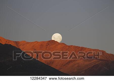 Moon setting behind ridge along Highway 23, near El Chalten; Santa Cruz, Argentina View Large Photo Image Stock Photo - Moon setting behind ridge along Highway 23, near El Chalten; Santa Cruz, Argentina. Fotosearch