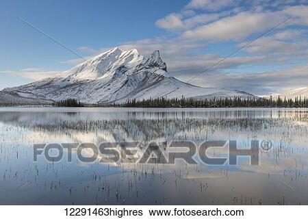 Morning light highlights fresh snow on Mt. Sukakpak in the Brooks Range, Arctic Alaska View Large Photo Image Stock Photograph - Morning light highlights fresh snow on Mt. Sukakpak in the Brooks Range, Arctic Alaska. Fotosearch