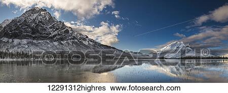 Mt. Dillon and Mt. Sukakpak reflecting in a pond in the Brooks Range north of Wiseman, Arctic Alaska, winter View Large Photo Image Stock Photograph - Mt. Dillon and Mt. Sukakpak reflecting in a pond in the Brooks Range north of Wiseman, Arctic Alaska, winter. Fotosearch