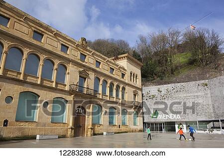 Museum of Basque history, with its old building, a 16th century convent at left, a new extension by Nieto Sobejano Architects at right, and Mount Urgull behind, with a Basque flag flying; San Sebastian, Spain View Large Photo Image Stock Photo - Museum of Basque history, with its old building, a 16th century convent at left, a new extension by Nieto Sobejano Architects at right, and Mount Urgull behind, with a Basque flag flying; San Sebastian, Spain. Fotosearch