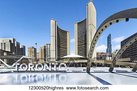 Stock Photograph - Nathan Philips Square skating rink at Toronto City Hall; Toronto, Ontario, Canada. Fotosearch
