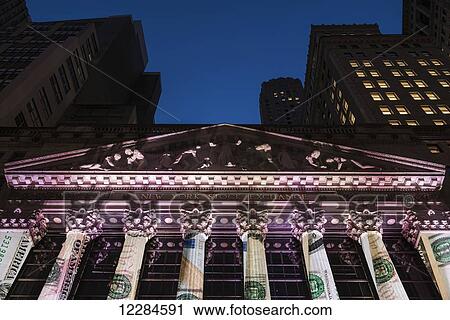 Stock Image - New York Stock Exchange at twilight; New York City, New York, United States of America. Fotosearch