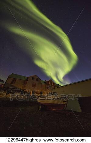 Stock Photograph - Northern lights dancing in the skies above Djupavik; West Fjords, Iceland. Fotosearch