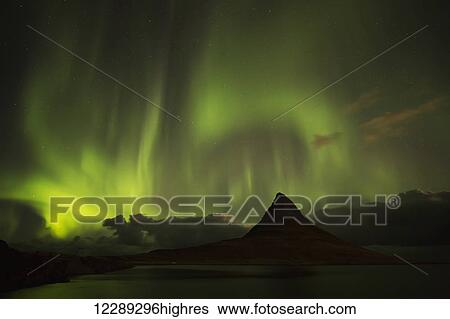 Northern lights over top of Kirkjufell, the most photographed mountain in Iceland; Iceland View Large Photo Image Stock Photograph - Northern lights over top of Kirkjufell, the most photographed mountain in Iceland; Iceland. Fotosearch