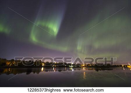 Stock Photograph - Northern Lights over Westchester Lagoon in downtown Anchorage, Southcentral Alaska, Autumn. Fotosearch