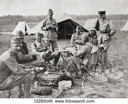 Stock Photo - Officers commanding the Indian native troops in France during WWI, seen here eating a frugal lunch. From The War Illustrated Album Deluxe, published 1915.. Fotosearch