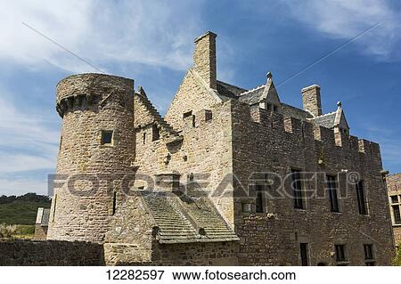 Old stone fort with turret and blue sky and clouds; Plevenon, Brittany, France View Large Photo Image Stock Photo - Old stone fort with turret and blue sky and clouds; Plevenon, Brittany, France. Fotosearch